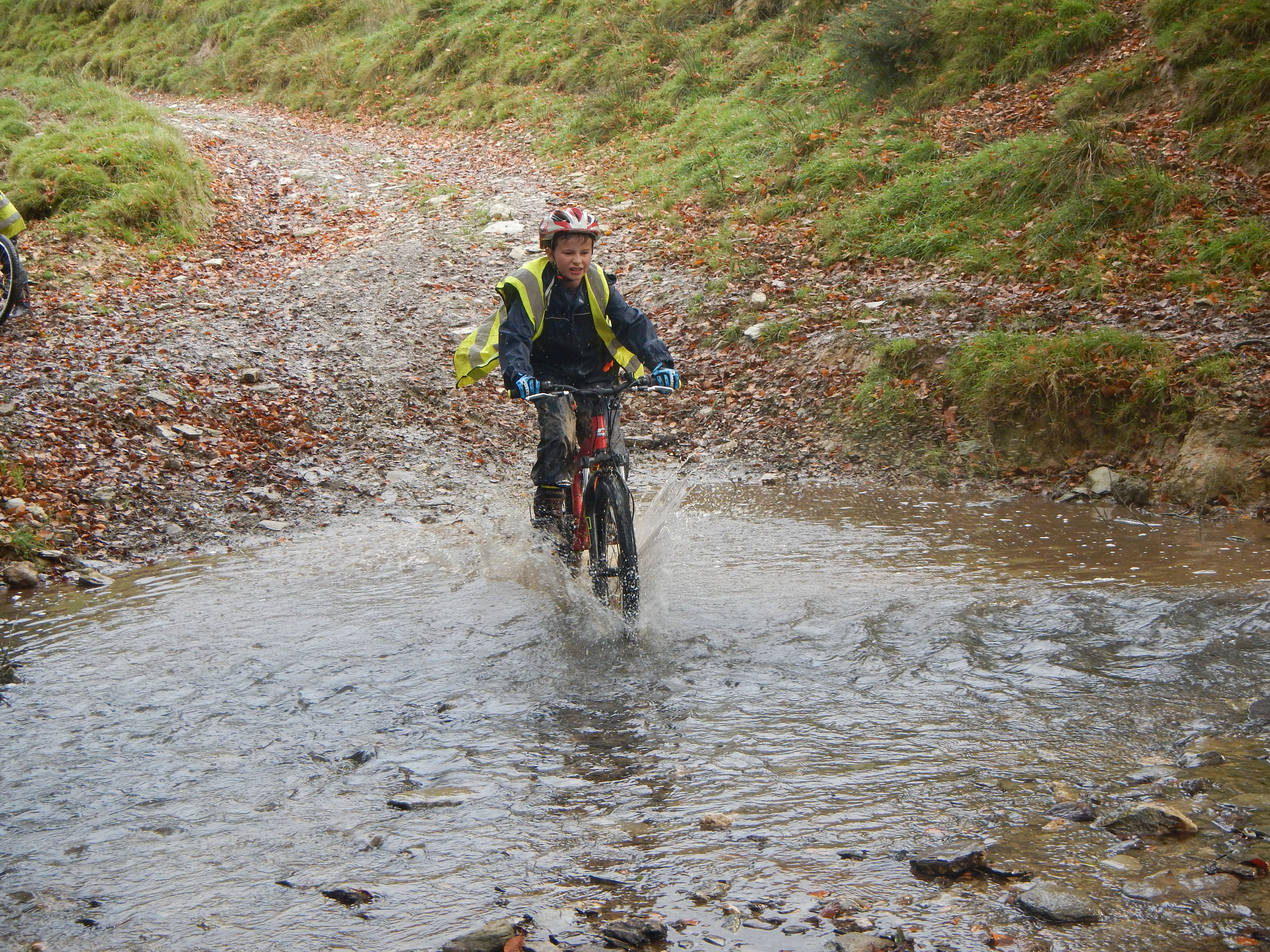 Mountain biking through river.JPG